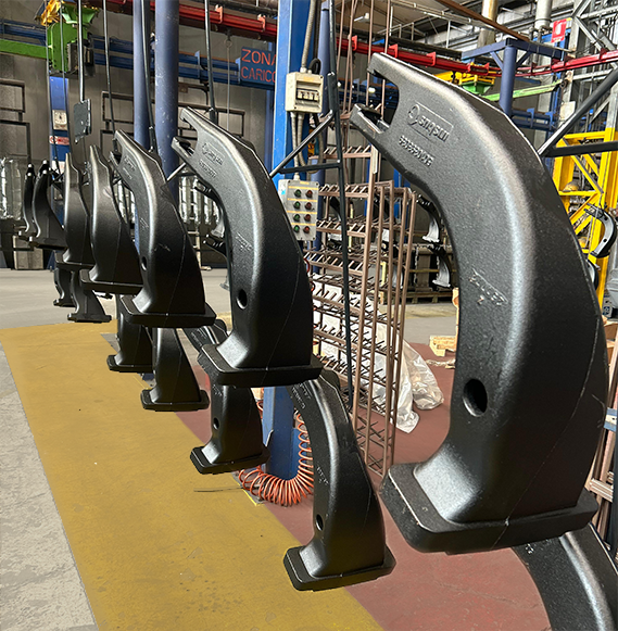 Metal components for suspension and chassis systems of commercial vehicles during the painting process